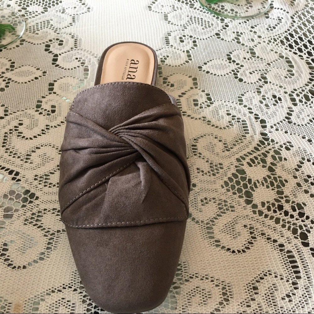 A beautiful pair of taupe faux mules .NEW